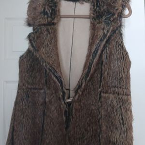 Faux fur and faux suede reversible vest.  Size m